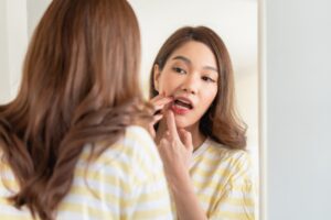 Our team at American Dental Center talk about receding gums treatment, causes, and costs.